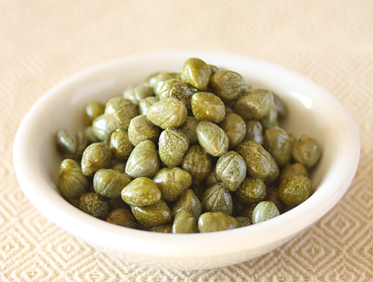 What Does Capers Taste Like: Exploring the Briny Burst of Flavor